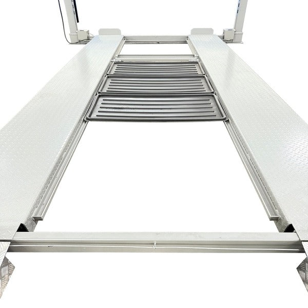 Close-up of NOS10000 four post lift runways with included drip trays