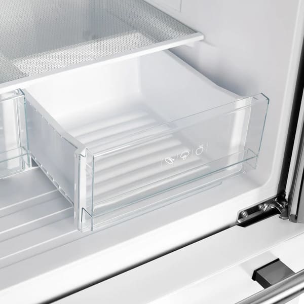 Close-up of the crisper drawer inside the Forno 30-inch refrigerator in white, featuring a clear design ideal for keeping fruits and vegetables fresh with optimal humidity control.