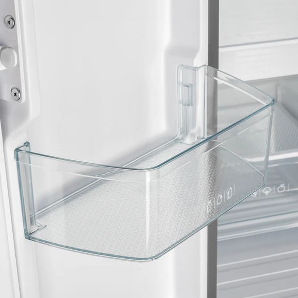 Close-up view of a clear door bin inside the Forno 30-inch refrigerator in white, designed for storing bottles, condiments, and small containers within easy reach.