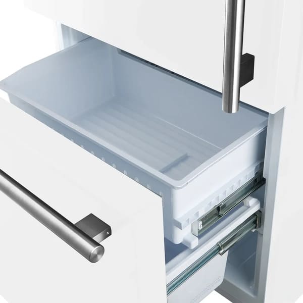 Close-up view of the freezer drawer in the Forno 31-inch left-hinge refrigerator in white, featuring a spacious pull-out design with organized compartments for efficient frozen food storage.