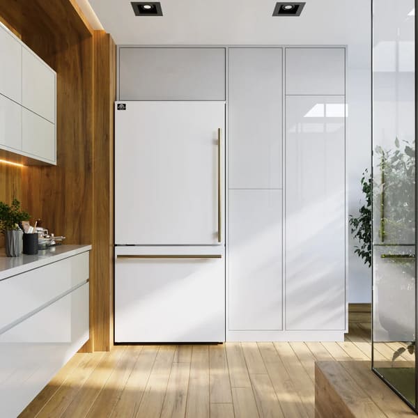 Lifestyle view of the Forno 31-inch refrigerator with left-hinge door in a white finish, seamlessly integrated into a modern kitchen setting with clean lines, contemporary cabinetry, and coordinated appliances.