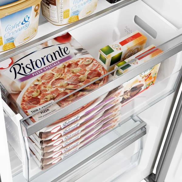 Close-up view of an interior drawer inside the FORNO 60-inch built-in pro-style refrigerator from the 2-Piece Appliance Package, featuring a spacious, clear pull-out design ideal for organizing fruits, vegetables, or deli items with smooth glide functionality.