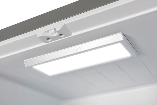 Interior lighting of the FORNO 30-inch French door refrigerator in stainless steel, showing bright LED illumination inside the main compartment.