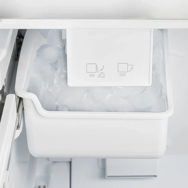 Close-up of the built-in ice maker inside the FORNO 36-Inch French Door Refrigerator in White, showing the compact design and ice storage compartment.