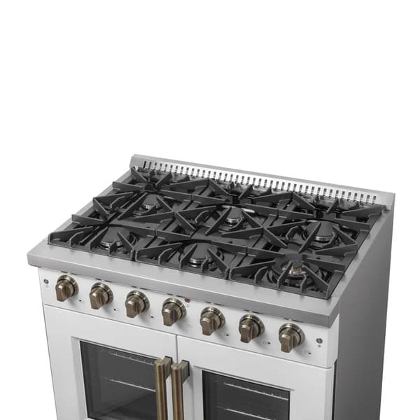 Right-angled view of the cooktop on the FORNO Galiano 36-Inch French Door Gas Range in white, featuring six Italian brass burners, continuous cast iron grates, and brass-accented control knobs.