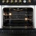 Interior view of the FORNO Giovanni 30-Inch Gas Range oven in black, featuring a vibrant blue enamel finish, convection fan, and durable multi-level oven racks.