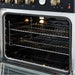 Right-angled interior view of the FORNO Marco 30-Inch Gas Range in black, highlighting the blue enamel oven finish, convection fan, and multiple chrome racks designed for even heat distribution and flexible cooking.