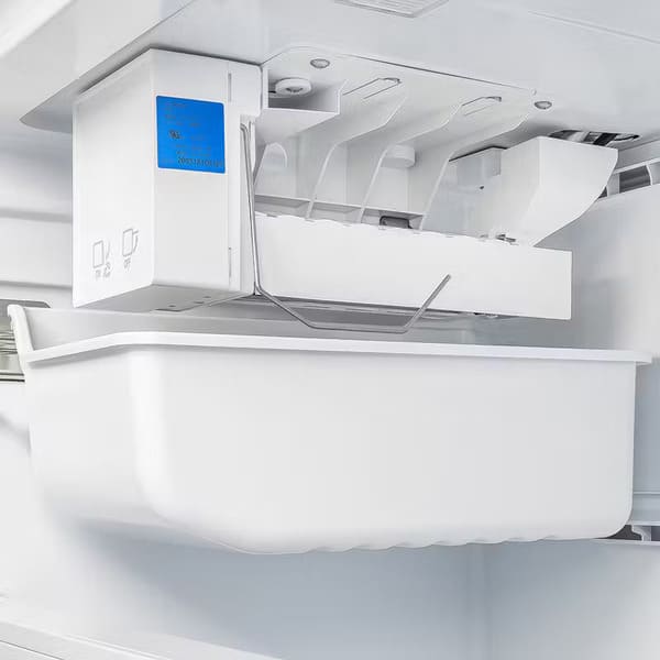 Close-up of the built-in ice maker inside the FORNO Moena 36″ French Door Refrigerator with Grill Trim, featuring automatic ice production and storage bin.
