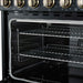 Angled interior view of the FORNO Paolo 36-Inch Electric Range in black, showcasing the spacious blue enamel oven cavity, convection fan, and durable multi-level oven racks.