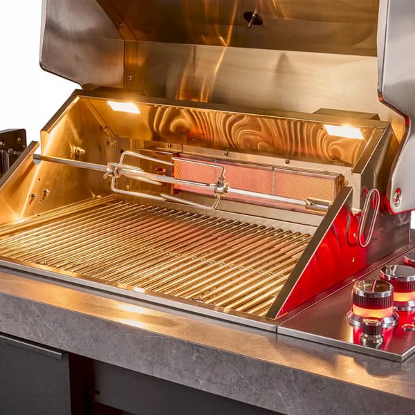 Close-up view of the FORNO Rimini 30-Inch Outdoor Kitchen’s rotisserie with integrated infrared burner, highlighting the stainless steel construction, rear-mounted burner element, and motorized spit rod for even, high-heat roasting performance.