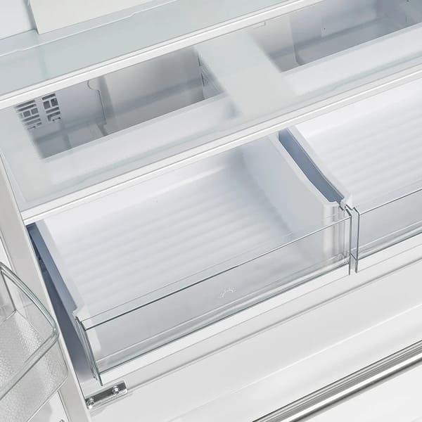 Interior view of the Forno 36-inch French door refrigerator in white, highlighting the lower drawers designed for organized storage of fresh produce, deli items, or beverages, with clear fronts for easy visibility.