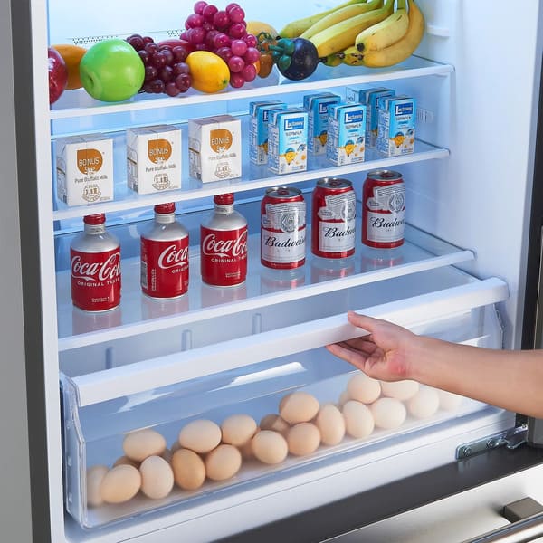 Interior view of FORNO Milano Stainless Steel Refrigerator showing adjustable glass shelves, crisper drawers, and organized food storage layout.
