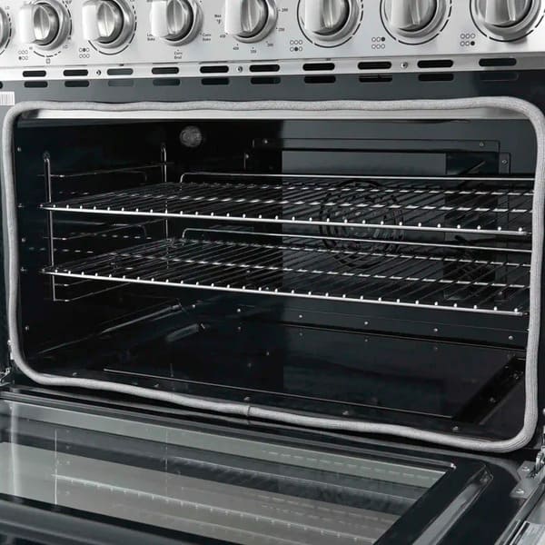 Angled interior view of the Forno Paolo 36-Inch Electric Range with Convection Oven, showing blue enamel oven cavity, convection fan, and heavy-duty racks for multi-level cooking.