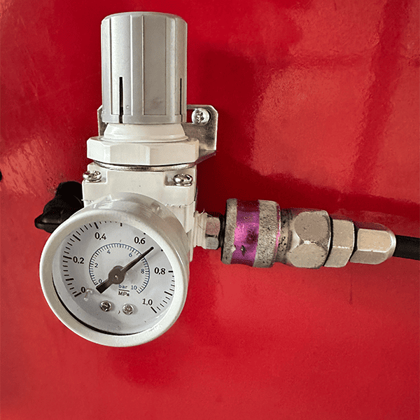 Close-up of Katool KT-B795L wheel balancer air pressure gauge for accurate pneumatic system monitoring.