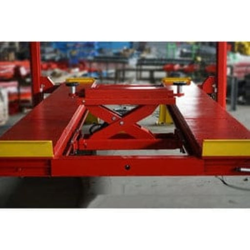 Katool KT-RJ60 rolling jack with 6,000 lb lifting capacity mounted on a 4-post car lift, designed for professional automotive service.