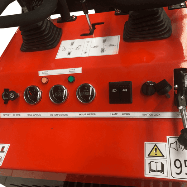 Dashboard controls of Katool KT-SK26W skid steer loader showing gauges, ignition, and joystick controls.