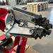 Detailed view of Katool KT-T160 tire changer clamping arm mechanism for secure wheel handling.