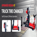 Katool KT-T260 heavy duty truck tire changer with upgraded design, shown in warehouse setting for effortless tire dismounting.