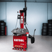Katool KT-T810 tire changer displayed in garage environment with stacked tires in background.