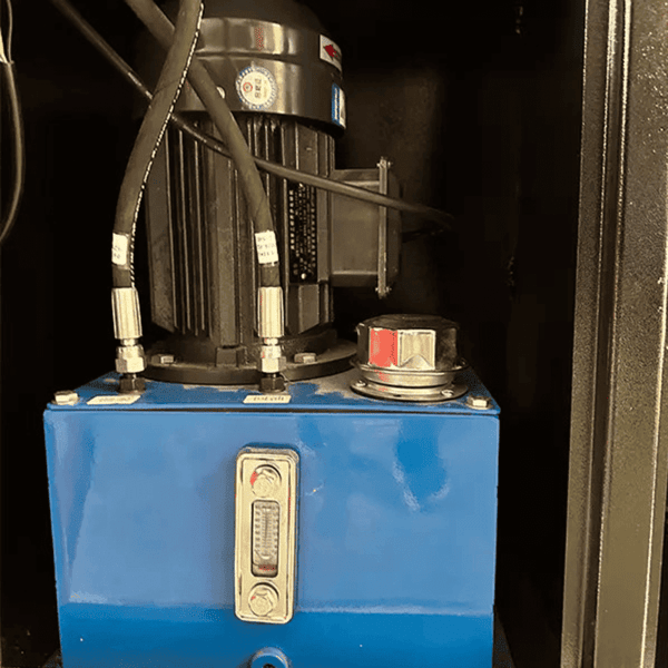 Detailed view of Katool KT-WL69 wheel straightening machine motor and hydraulic oil tank.