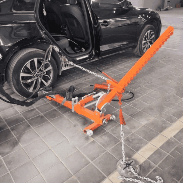 Katool KT-YA260 Auto Body Puller Frame Straightener repairing rear side of a car with chains and hydraulic arm.