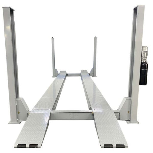 Front view of Triumph NTR-32 heavy duty four post auto lift with long diamond plate ramps for trucks and buses.