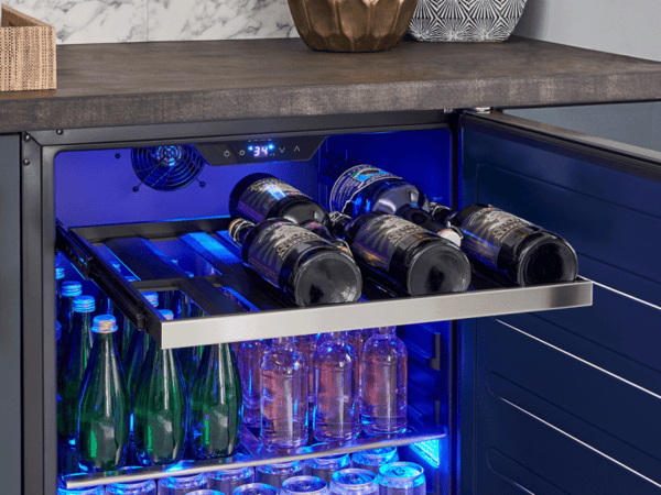 Close-up of the ZEPHYR beverage cooler's full-extension wooden rack, smoothly sliding out to provide easy access to stored beverages.