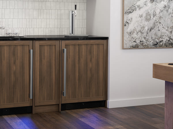 ZEPHYR Kegerator & Beverage Cooler with custom panel kit installed, blending seamlessly with surrounding cabinetry for a built-in, integrated look