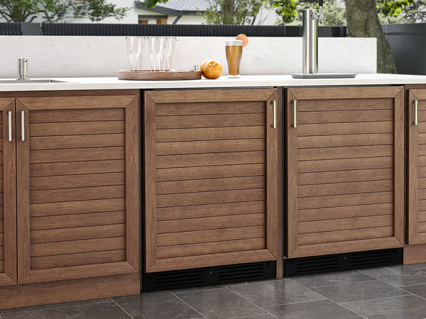 ZEPHYR Outdoor Beverage Cooler with custom panel kit installed for a seamless built-in cabinet look.