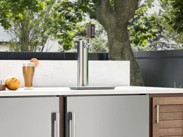 ZEPHYR Outdoor Kegerator & Beverage Cooler shown head-on with a chalkboard handle, allowing custom labeling for beverages in an outdoor entertainment space