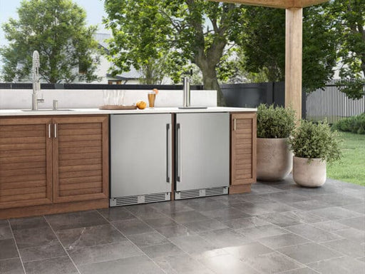 ZEPHYR Outdoor Kegerator & Beverage Cooler shown installed in an outdoor kitchen setup, highlighting its seamless built-in design and durable stainless steel finish