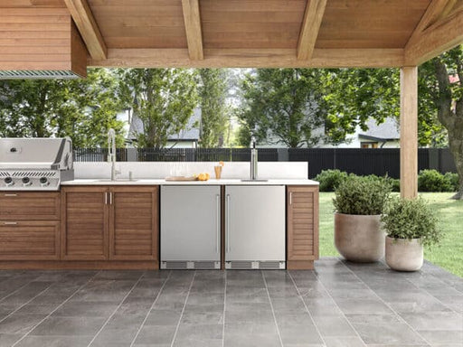 ZEPHYR Outdoor Kegerator & Beverage Cooler in a full outdoor kitchen environment, showcasing its stainless steel design and built-in installation