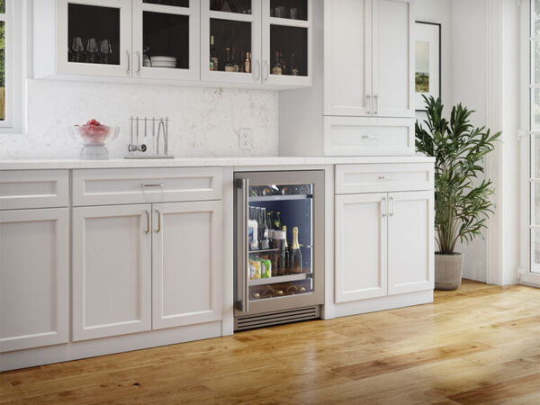 ZEPHYR Pro Single Zone Beverage Cooler in a modern kitchen, shown at an angle with the door open and shelves retracted, revealing beverage storage layout