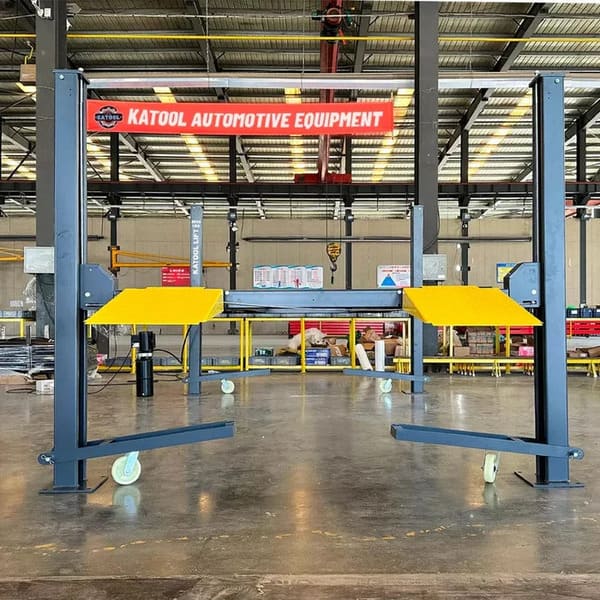 Katool KT-4H850 4-Post Lift stored in warehouse – ready for shipment with secured packaging and durable construction visible.

